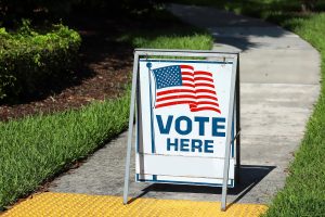 VOTE HERE SIGN placed on the walkway to a neighborhood polling place, as seen on election day in Fort Lauderdale, Florida.