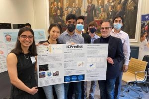 BME design team with Robert Stevens in 2022 holding ICPredict project poster