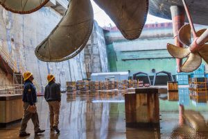 Engineers inspect the USS Nimitz (CVN 68) aircraft carrier in dry dock, representing the types of complex maintenance and modernization challenges where APL’s tools and technologies can accelerate maritime industrial agility. Credit: U.S. Navy/Thiep Van Nguyen II