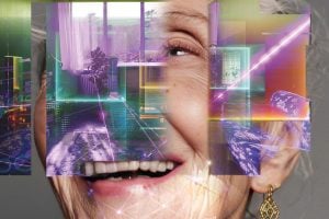 Portrait of a smiling person with grey hair