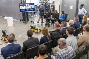 David Patrone, a lead robotics researcher at APL, leads a demonstration of an AI agent that can coordinate heterogeneous robotic teams in APL’s Intelligent Systems Center.  Credit: Johns Hopkins APL/Craig Weiman